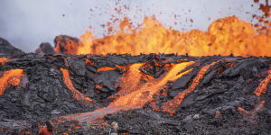 ‘Dancing fire’:Tourists trek to see Iceland volcano eruption up close