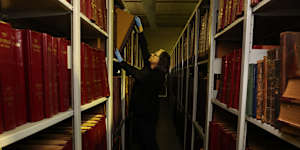 Photo special Harry Hollinsworth in the Fairfax Archives warehouse.