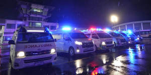 Ambulances wait to carry passengers from a London-Singapore flight that encountered severe turbulence.