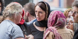 New Zealand Prime Minister Jacinda Ardern with members of Christchurch's Muslim community the day after the mosque attacks.