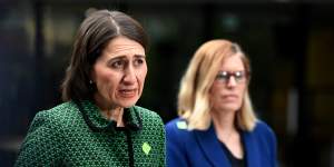 (L-R) NSW Premier Gladys Berejiklian and NSW Chief Health Officer Dr Kerry Chan speak to the media during a press conference in Sydney,Tuesday,March 24,2020. The state of NSW has shut down all non-essential services to slow the rapidly spreading coronavirus,but schools remain open for now. (AAP Image/Bianca De Marchi)