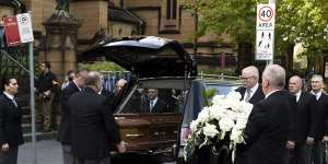 Cardinal George Pell’s coffin arrives at St Mary’s Cathedral.