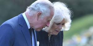 Prince Charles and Camilla,the Duchess of Cornwall,inspect flowers left for Prince Philip. 