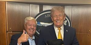 Republican Senator Lindsey Graham meeting with the President Donald Trump holding a Make Iran Great Again hat.