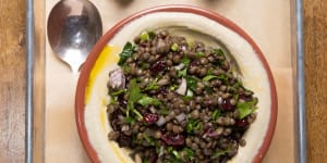 Hummus loaded with lentil and grain salad.