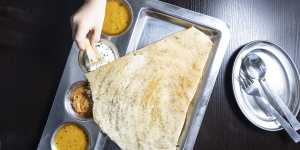 Tear the dosa,dip it in sambar and enjoy.