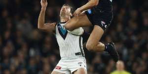 Jack Silvagni of the Blues and Scott Lycett of the Power.