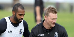 Heritier Lumumba with Nathan Buckley at a Collingwood training session in 2014.