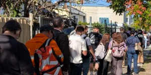 Northside commuters wait for replacement buses to continue their journey.