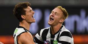 Brody Mihocek and Jaidyn Stephenson celebrates a goal late in Collingwood's win over West Coast.