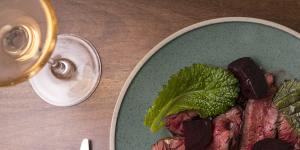 Hanger steak with mustard leaf and beetroot.