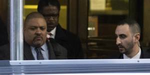 Manhattan District Attorney Alvin Bragg (centre) leaves the District Attorney’s office in New York.