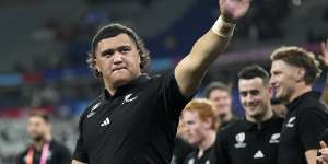 New Zealand’s Tamaiti Williams greets fans after the Rugby World Cup semifinal