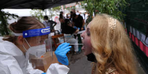 A participant submits for an express PCR test outside the KiKat Club in Berlin. 