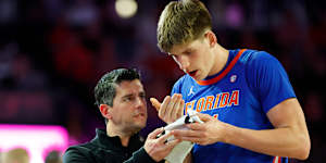 Alex Condon is treated by a trainer after having two teeth knocked out against Georiga in February.