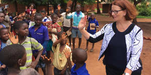 Greeting schoolchildren in Malawi.