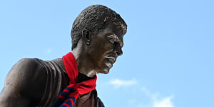 A Demons scarf adorns the statue of Jim Stynes outside the MCG