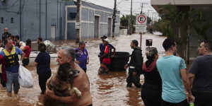 Residents evacuate from a neighbourhood flooded by heavy rains,in Canoas,Brazil.