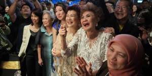 Michelle Yeoh’s mother Janet (second from right) celebrates after her daughter wins best actress.