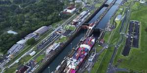 A cargo ship traverses the Panama Canal.