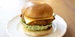 Fish burger made with hoki,cucumber pickles,mustard seed,lettuce and American cheddar.