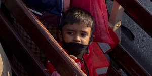 Unable to return to Myanmar for fear of persecution,these Rohingya refugees are on a Bangladesh navy vessel,being moved from an overcrowded camp on mainland Bangladesh to Bhasan Char island,In late December.