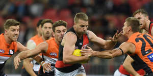 Stringer fights his way clear from several GWS opponents.