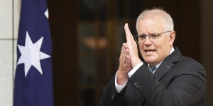 Prime Minister Scott Morrison explaining the trajectory of the Omicron outbreak on Wednesday.