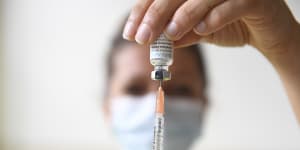 A health professional prepares a dose of a monkeypox vaccine at the Edison municipal vaccination centre in Paris.