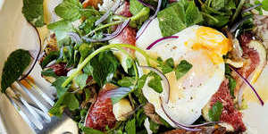 Poached eggs with smoked ham hock,figs and macadamias.