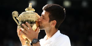 Novak Djokovic kisses the championship trophy after winning the Wimbledon men's final in 2018. Wimbledon has been cancelled for the first time since WWII.