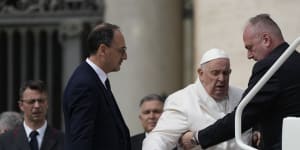 Pope Francis helped to get on his car at the end of weekly general audience in St Peter’s Square,at the Vatican.