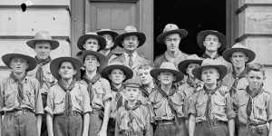 Wolf Cubs and Boy Scouts standing outside a hall,New South Wales,ca. 1930.