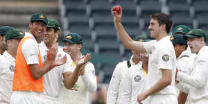 Pat Cummins (second from right) on debut in 2011 after bowling Morne Morkel. 