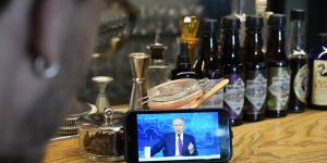 A man watches a live stream of Russian President Vladimir Putin’s annual televised call-in show,in a bar in Moscow,last year. Russians have been fed a diet of propaganda by the Kremlin for years.