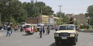 Members of the Taliban drive through the city of Herat,Afghanistan,west of Kabul,on Saturday.