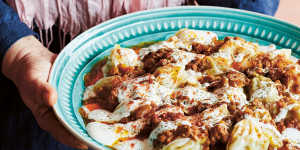 Mantu is finished with a generous drizzle of garlic-yoghurt dressing,and a sprinkling of dried mint and paprika.
