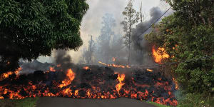 Fast flowing lava from Hawaii's volcano threatens to trap residents