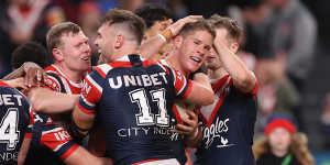 The Roosters celebrate an Egan Butcher try.