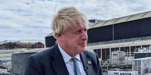 UK Prime Minister Boris Johnson attends the commissioning of HMS Anson,Britain’s newest Astute-class submarine,at the BAE Systems shipyards in Barrow,England on Wednesday.