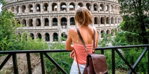 Female contemplating the Colosseum in Rome,Italy People travel enjoying capital cities of Europe concept iStock image for Traveller. Re-use permitted. Female tourist at the Colosseum,Rome