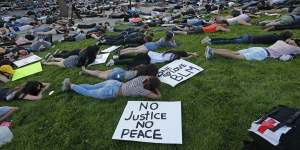 Protesters lie down for eight minutes and 46 seconds during a protest at the University of Utah.