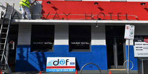The Railway Hotel in Yarraville gets painted in Bulldogs'club colours.