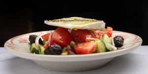 Greek village salad is made with big hunks of tomato and feta and crisp cucumber.