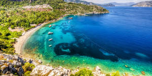 The Turkish island of Marmaris (pictured) can be a bargain but beware the high-season hordes of northern Europeans.