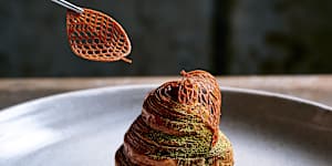 Pear monaka,a pear-shaped croissant brushed with amaretto syrup and filled with pear compote and hojicha ice-cream. It rests on a bed of dulcey whipped ganache,ginger caramel and brown butter crumble.