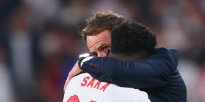 England manager Gareth Southgate consoles Bukayo Saka after the defeat to Italy.