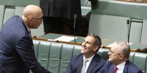 Opposition Leader Peter Dutton shakes hands with Prime Minister Anthony Albanese in between divisions in the House of Representatives.