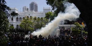 Police use teargas as Sri Lankan protesters storm the compound of prime minister Ranil Wickremesinghe’s office,demanding he resign after president Gotabaya Rajapaksa fled amid economic crisis in Colombo,Sri Lanka,on Wednesday.