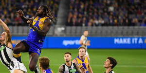 Nic Naitanui flies for a mark against Collingwood.